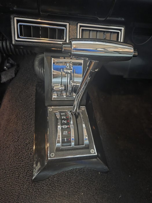 Custom center console with floor shifter and Vintage Air climate controls
