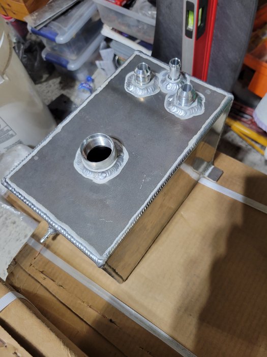 Custom aluminum tank — TIG-welded bungs and fittings