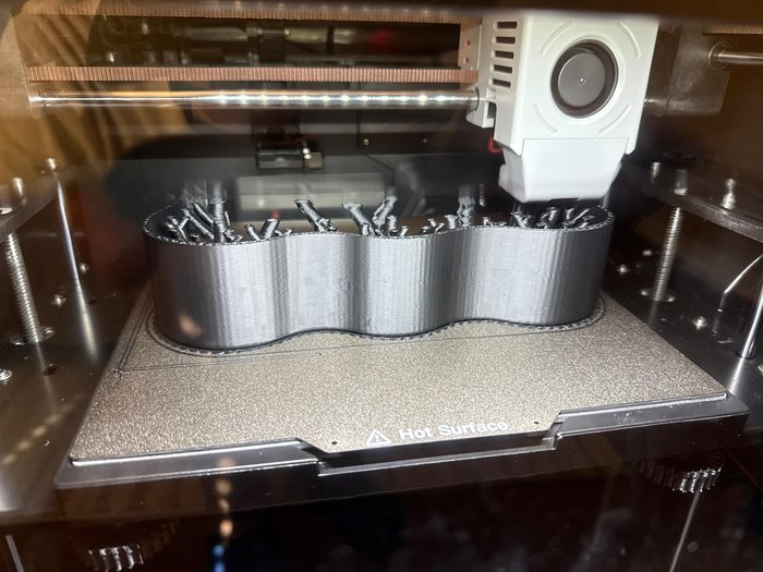 A custom part on the 3D printer, made in-house